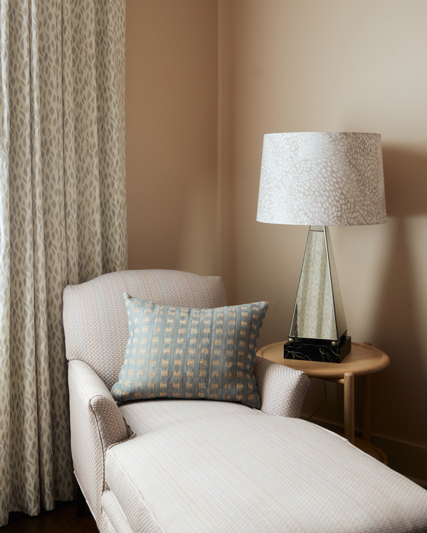 Channels Chaise Lounge in Sunset, Petals Draperies in Taupe-Rose, Speckled Lampshade in Taupe/Fawn, and Gridded Ikat Pillow in Blue Pink